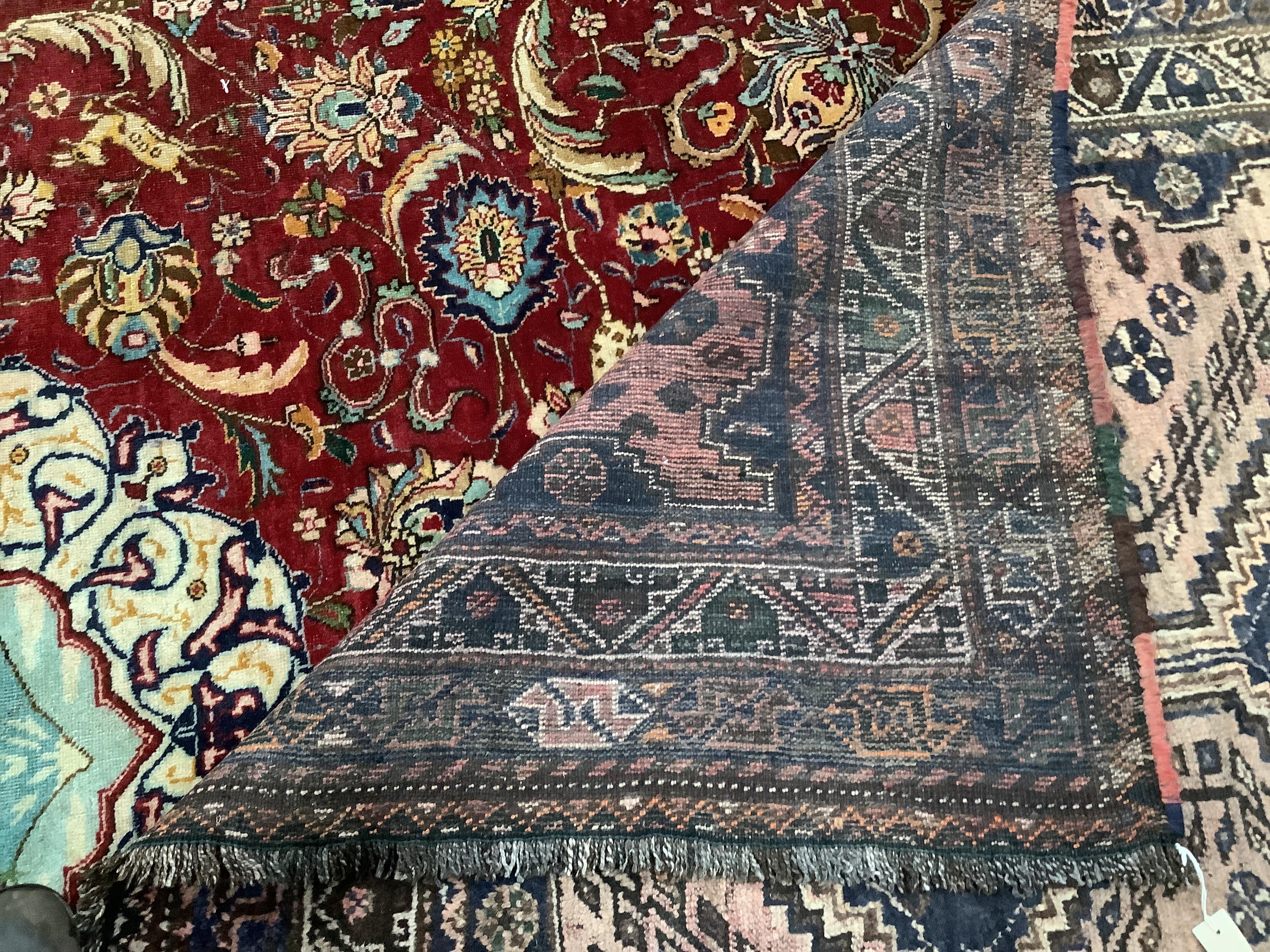 A North West Persian red ground carpet, approximately 340 x 240cm